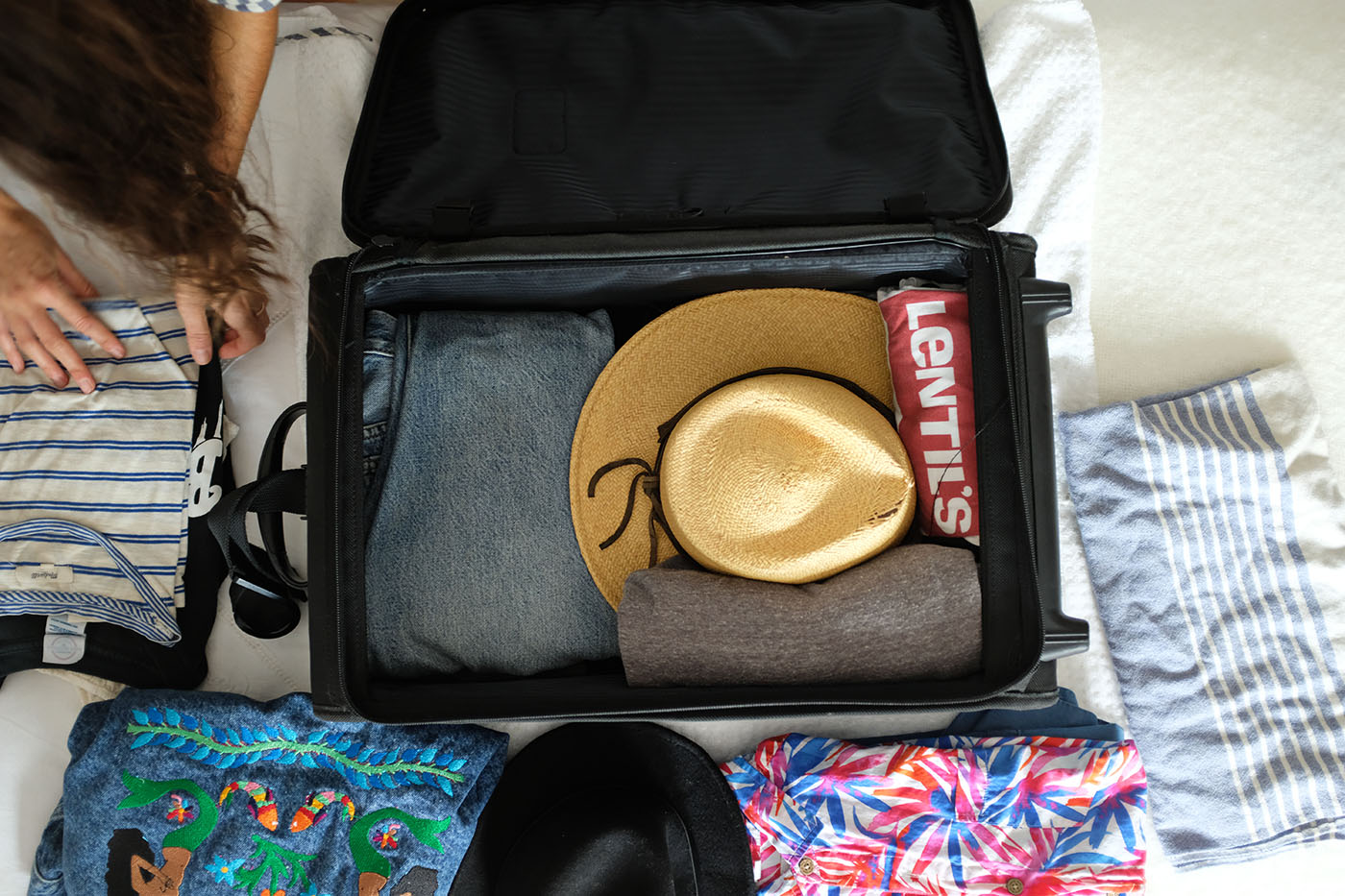 ohdeardrea-travel-blog-how-to-pack-a-hat-rolls-1.jpg