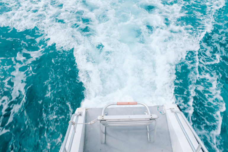 ocean water at the back of the boat