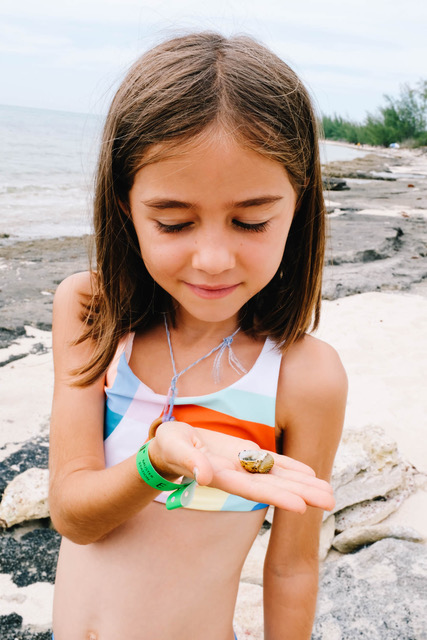 daughter holding small shell