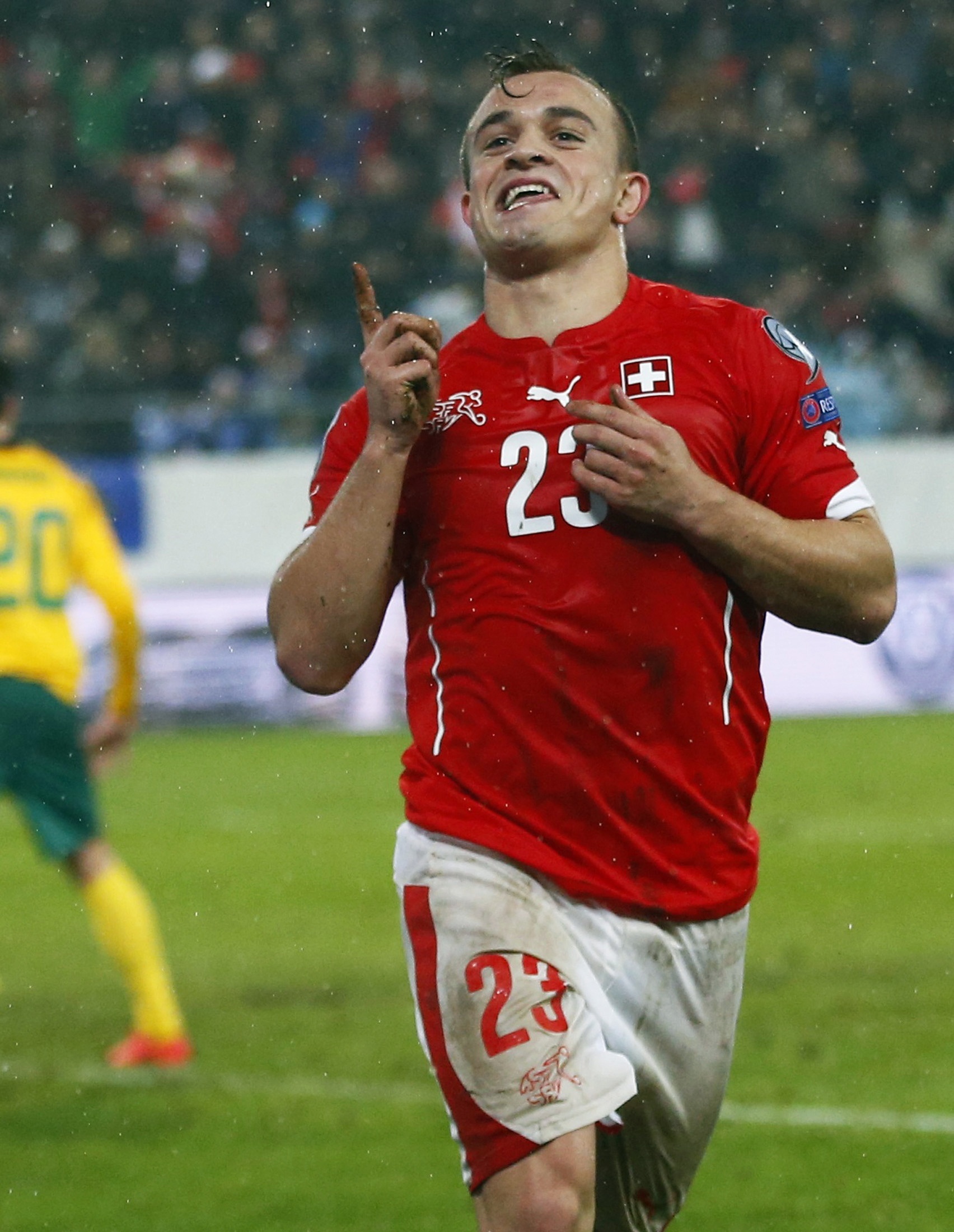 Switzerland's Xherdan Shaqiri celebrates after scoring a goal during their Euro 2016 Group E qualifying soccer match against Lithuania at AFG Arena in St. Gallen
